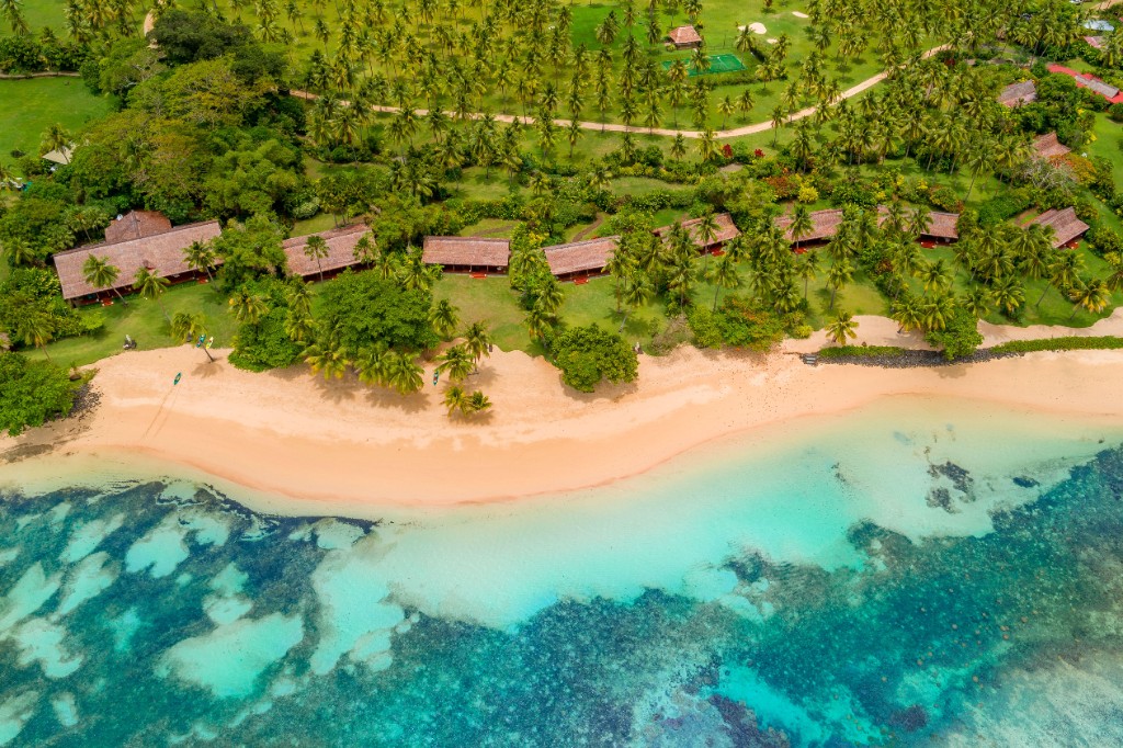 Aerial view of a tropical Fiji beach and luxury resort